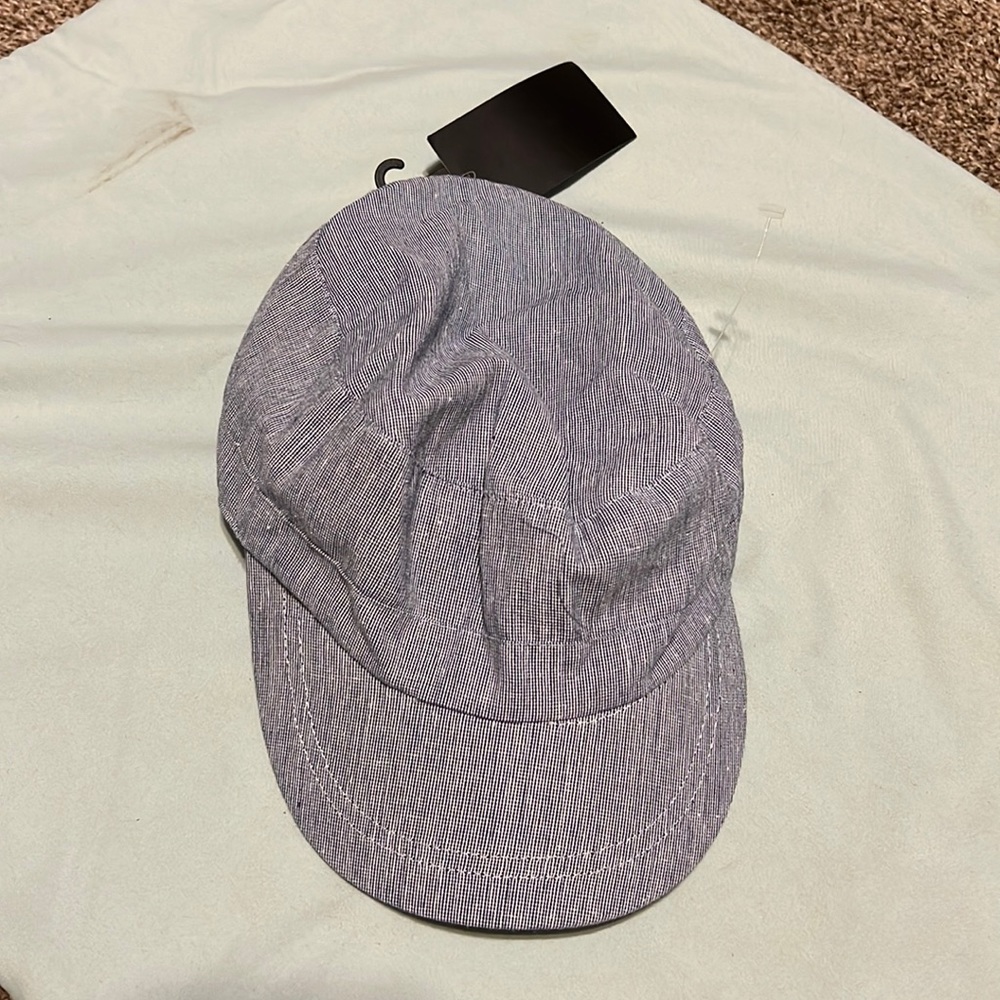 Weatherproof blue/white cap with elastic back.